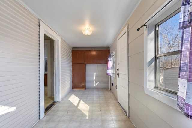 1006 Porter St, Taylor, TX 76574 - hall featuring wood walls and light flooring