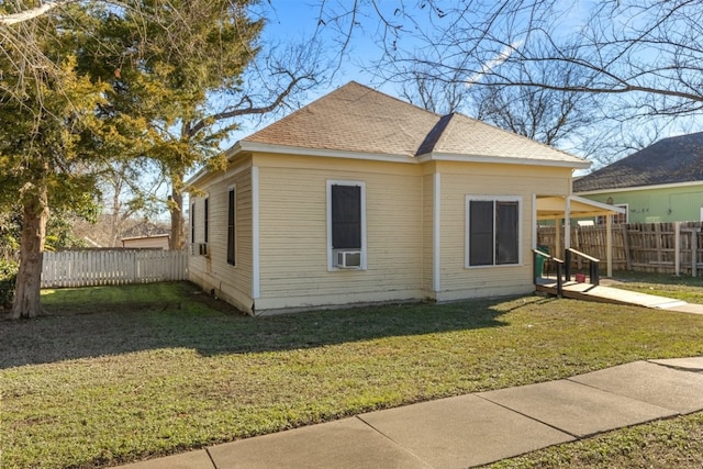 1006 Porter St, Taylor, TX 76574 - view of property exterior featuring a fenced backyard, a shingled roof, and cooling unit