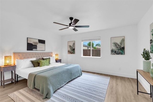 111 Woodley Rd, Leander, TX 78641 - bedroom with wood finished floors and a ceiling fan