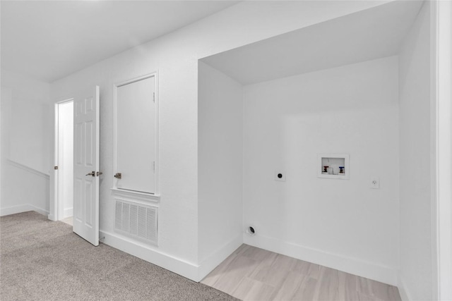 111 Woodley Rd, Leander, TX 78641 - washroom with hookup for an electric dryer, hookup for a washing machine, and light colored carpet