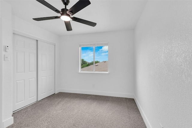 111 Woodley Rd, Leander, TX 78641 - unfurnished bedroom featuring carpet, a closet, and ceiling fan