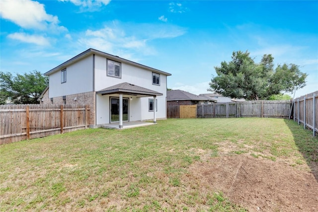 111 Woodley Rd, Leander, TX 78641 - rear view of house featuring a patio, a fenced backyard, and brick siding
