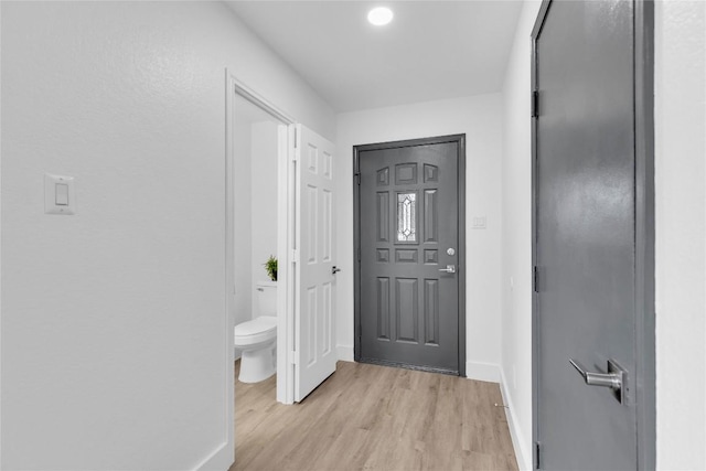 111 Woodley Rd, Leander, TX 78641 - entrance foyer with light wood-style floors and baseboards