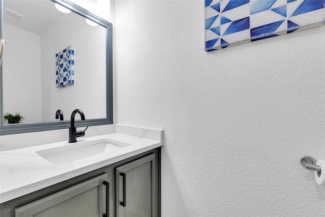 111 Woodley Rd, Leander, TX 78641 - bathroom with vanity and a textured wall