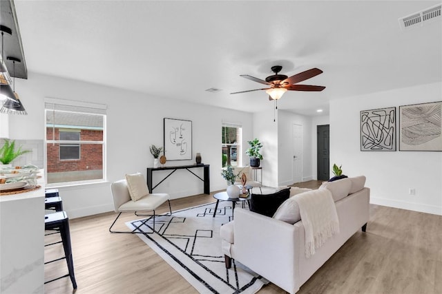 111 Woodley Rd, Leander, TX 78641 - living room with light wood finished floors and a ceiling fan