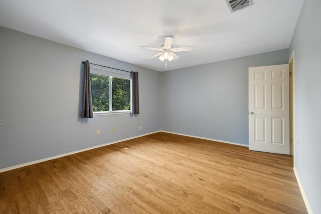 8204 Ito Cv, Austin, TX 78729 - unfurnished room featuring a ceiling fan and light wood finished floors