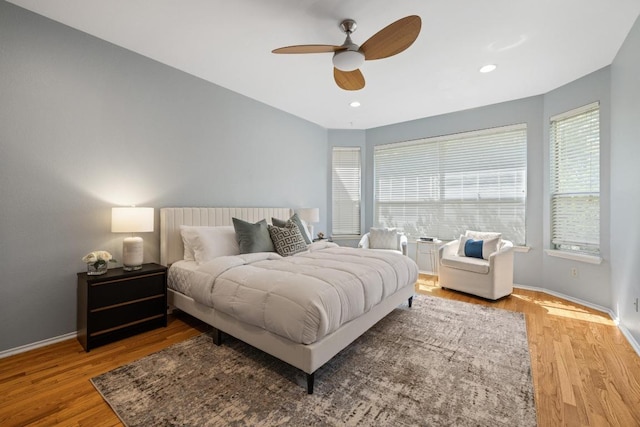 8204 Ito Cv, Austin, TX 78729 - bedroom featuring wood finished floors, ceiling fan, and recessed lighting