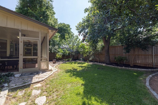 8204 Ito Cv, Austin, TX 78729 - fenced backyard with a sunroom