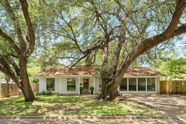 8102 Shadowood Dr, Austin, TX 78757 - view of front of property with brick siding and concrete driveway