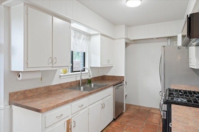 8102 Shadowood Dr, Austin, TX 78757 - kitchen featuring stainless steel appliances and white cabinets