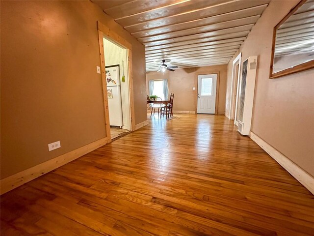 407 4th Ave, Smithville, TX 78957 - unfurnished room with a heating unit, wood finished floors, and a ceiling fan