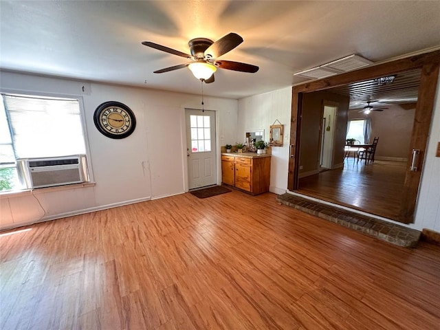 407 4th Ave, Smithville, TX 78957 - foyer entrance featuring a ceiling fan, cooling unit, and light wood-type flooring