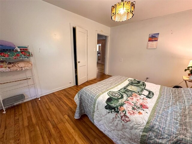 407 4th Ave, Smithville, TX 78957 - bedroom featuring wood finished floors and baseboards