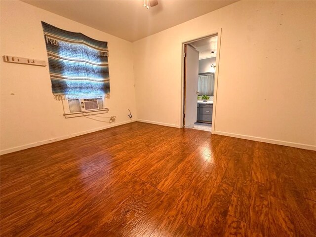 407 4th Ave, Smithville, TX 78957 - empty room featuring wood finished floors and cooling unit