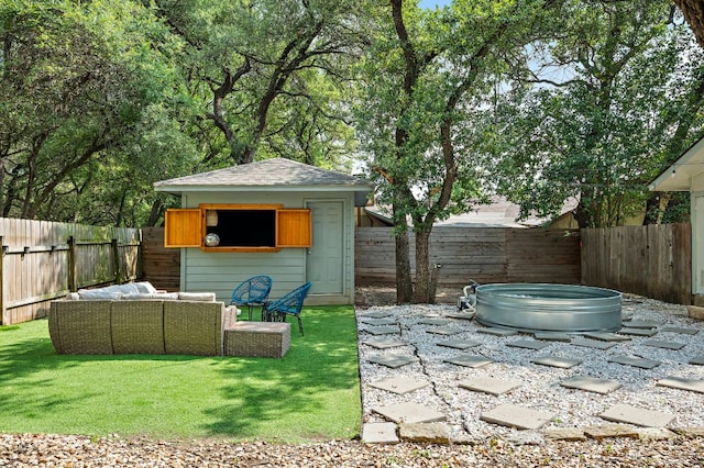 7303 Lunar Dr, Austin, TX 78745 - fenced backyard with an outdoor hangout area and an outdoor structure