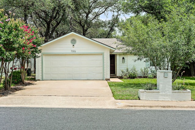 7303 Lunar Dr, Austin, TX 78745 - ranch-style house featuring driveway and a garage