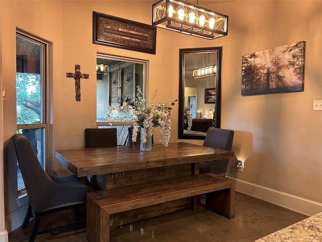 304 Bluestem Cv, Georgetown, TX 78633 - dining space featuring finished concrete floors and a chandelier
