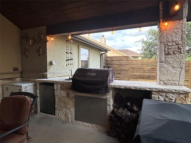 304 Bluestem Cv, Georgetown, TX 78633 - view of patio with an outdoor kitchen and a sink