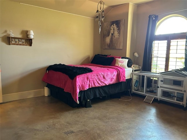 304 Bluestem Cv, Georgetown, TX 78633 - bedroom featuring multiple windows and finished concrete flooring