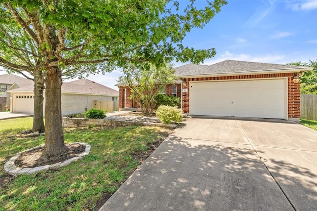 517 Castebar Dr, Round Rock, TX 78664 - single story home with brick siding, concrete driveway, an attached garage, and a shingled roof
