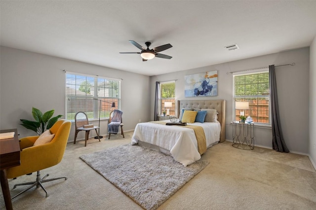 517 Castebar Dr, Round Rock, TX 78664 - carpeted bedroom with multiple windows and ceiling fan