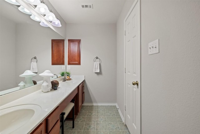 517 Castebar Dr, Round Rock, TX 78664 - bathroom with double vanity and baseboards