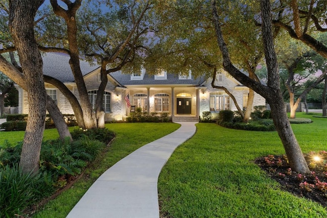 2319 Woodway Dr, Round Rock, TX 78681 - view of front of home featuring stone siding and a front lawn