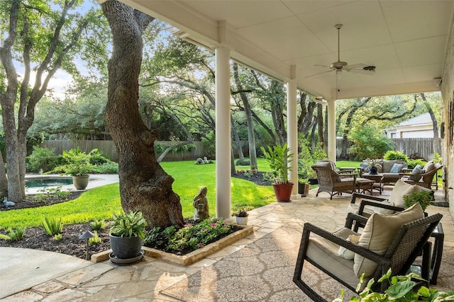 2319 Woodway Dr, Round Rock, TX 78681 - fenced backyard featuring ceiling fan, an outdoor hangout area, and a patio area