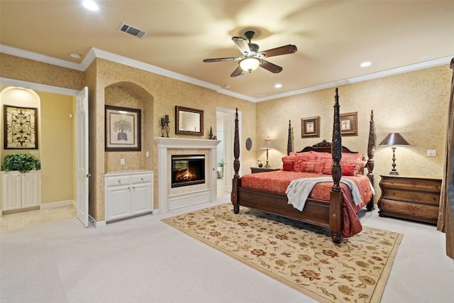 2319 Woodway Dr, Round Rock, TX 78681 - bedroom featuring light colored carpet, a glass covered fireplace, recessed lighting, crown molding, and ceiling fan