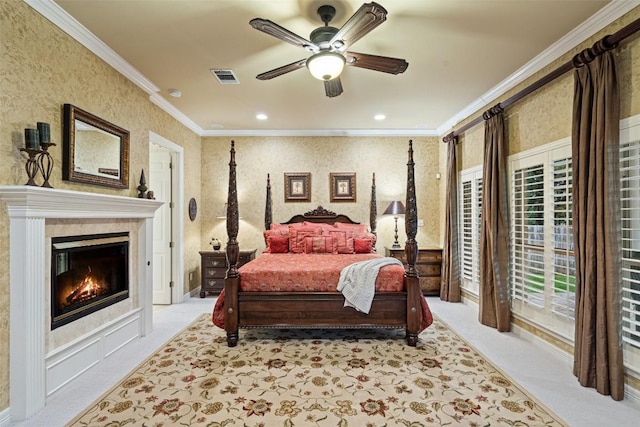 2319 Woodway Dr, Round Rock, TX 78681 - bedroom featuring ornamental molding, light colored carpet, wallpapered walls, a glass covered fireplace, and recessed lighting