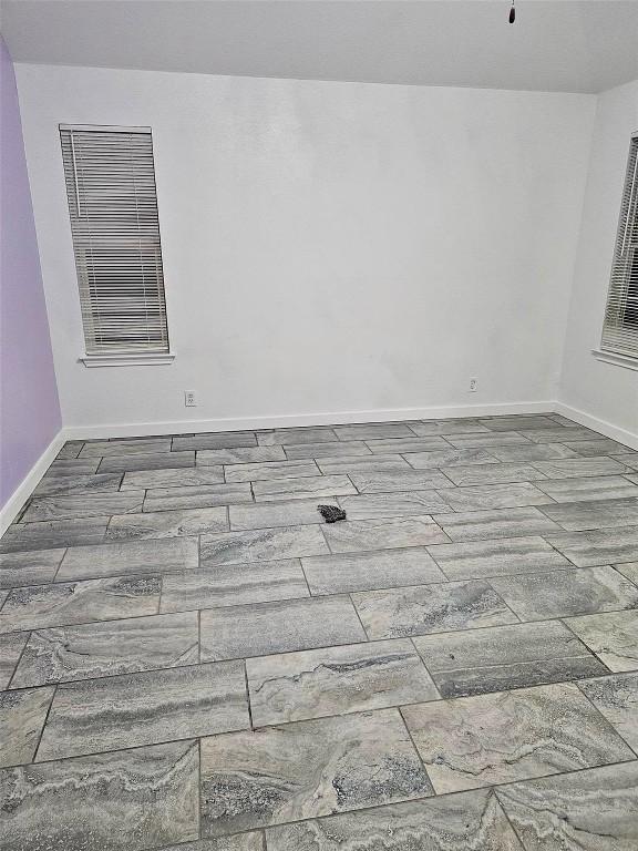16828 Jaron Dr, Manor, TX 78653 - unfurnished room featuring baseboards and wood finished floors