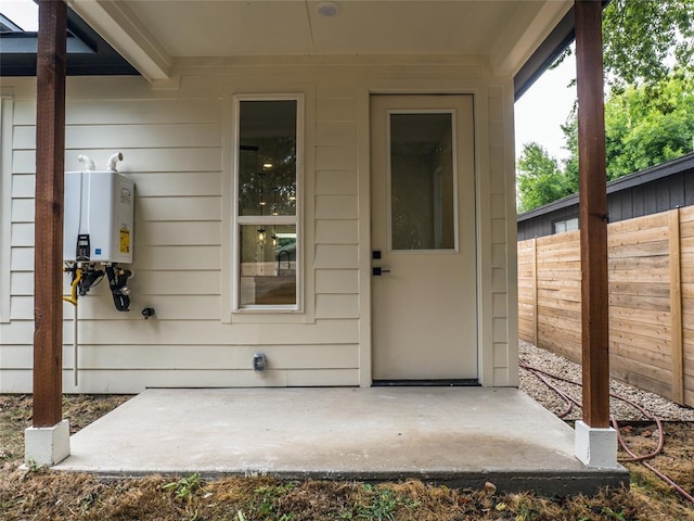 2009 Iroquois Ln Unit B, Austin, TX 78741 - property entrance with water heater and a patio