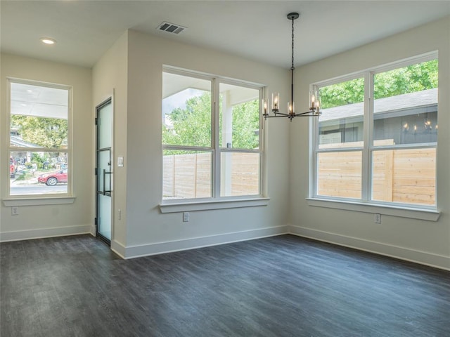 2009 Iroquois Ln Unit B, Austin, TX 78741 - unfurnished dining area with a chandelier, dark wood finished floors, plenty of natural light, and recessed lighting