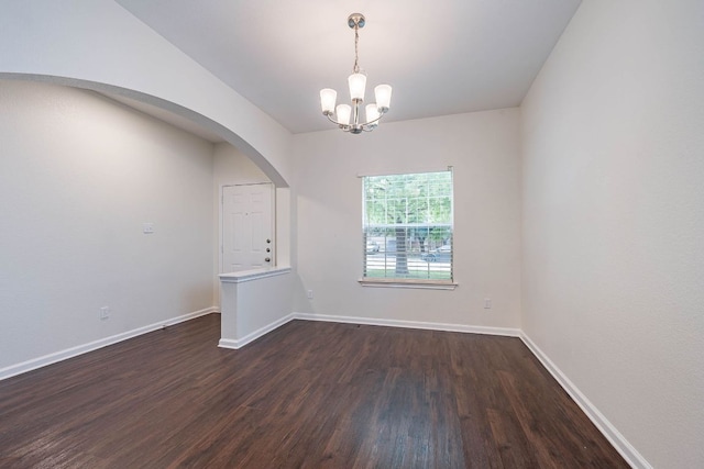 18111 Gallant St, Manor, TX 78653 - spare room with dark wood-style flooring, a chandelier, and arched walkways
