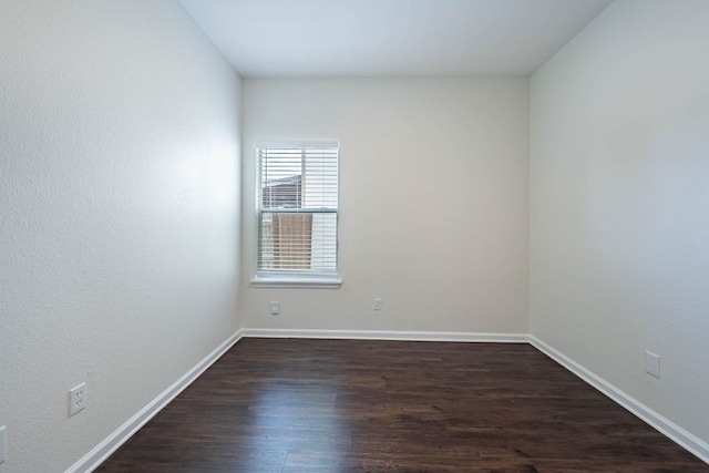 18111 Gallant St, Manor, TX 78653 - empty room with dark wood-style flooring and baseboards