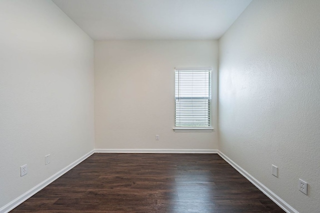 18111 Gallant St, Manor, TX 78653 - empty room with dark wood-type flooring and baseboards
