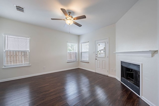 18111 Gallant St, Manor, TX 78653 - unfurnished living room featuring a ceiling fan, dark wood-type flooring, and a fireplace