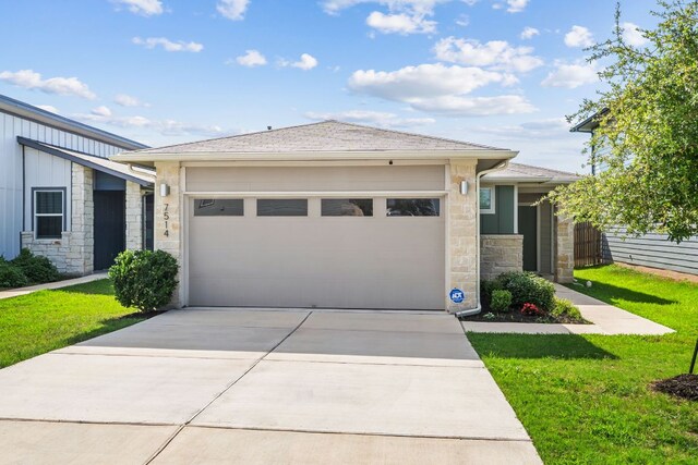 7514 Daves Landing Dr, Austin, TX 78724 - view of front of home with stone siding, an attached garage, driveway, a front yard, and roof with shingles