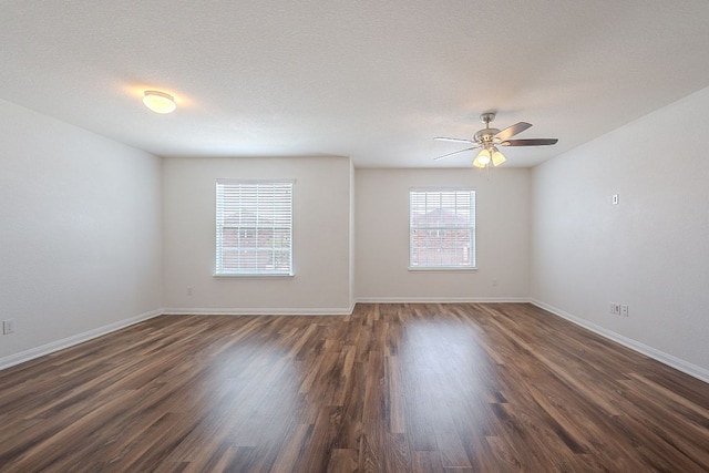 20016 Woodrow Wilson St, Manor, TX 78653 - unfurnished room with dark wood-style flooring and ceiling fan