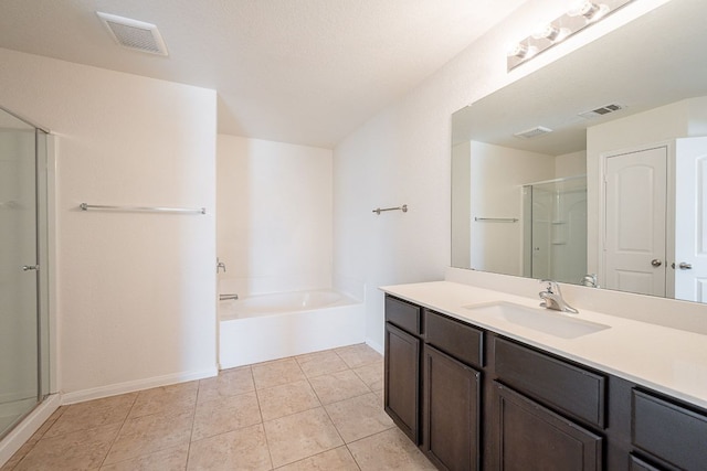 20016 Woodrow Wilson St, Manor, TX 78653 - full bathroom featuring vanity, a garden tub, tile patterned floors, and a shower with door