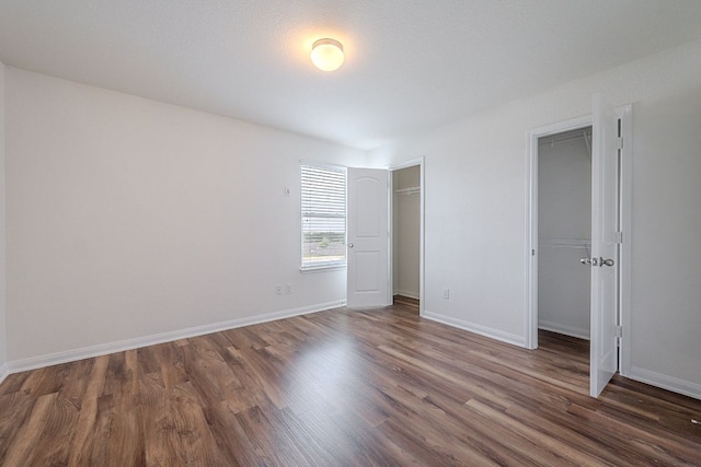 20016 Woodrow Wilson St, Manor, TX 78653 - unfurnished bedroom featuring wood finished floors