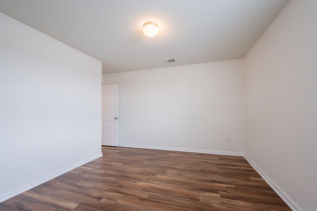 20016 Woodrow Wilson St, Manor, TX 78653 - empty room featuring dark wood-style floors