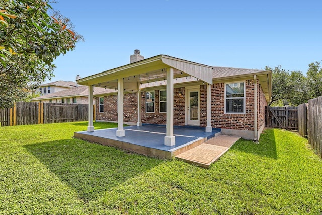 9508 Castle Pines Dr, Austin, TX 78717 - back of house featuring a patio, brick siding, a fenced backyard, and a chimney