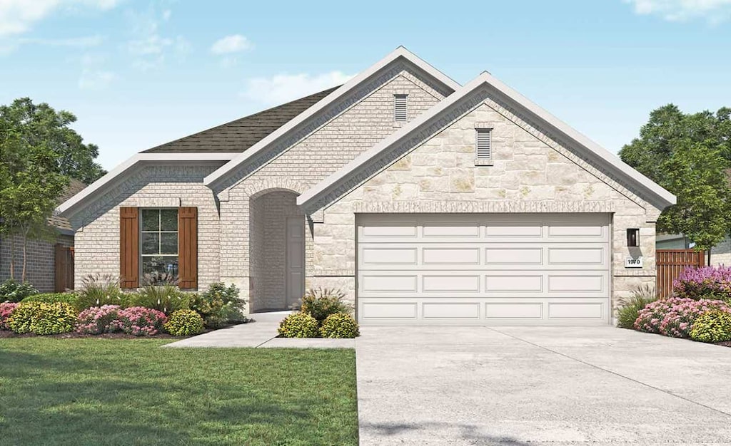 236 Du Bois Ln, Kyle, TX 78640 - french country home featuring concrete driveway, an attached garage, a front yard, and brick siding
