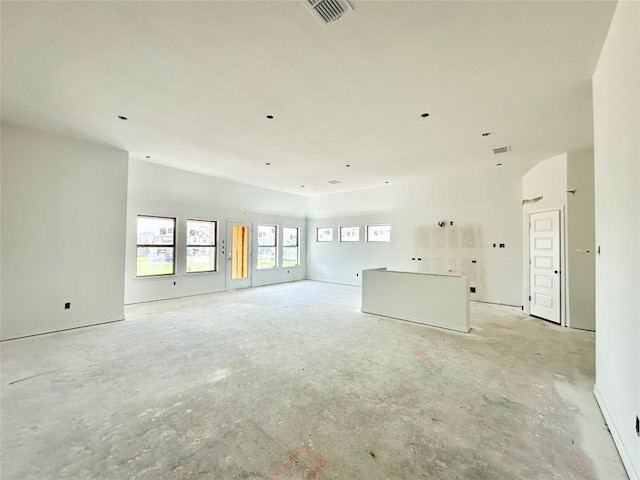 236 Du Bois Ln, Kyle, TX 78640 - unfurnished living room featuring unfinished concrete flooring