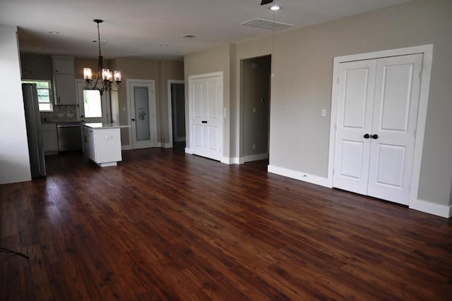 215 E 8th St, Elgin, TX 78621 - kitchen with open floor plan, a chandelier, dark wood finished floors, a center island, and recessed lighting