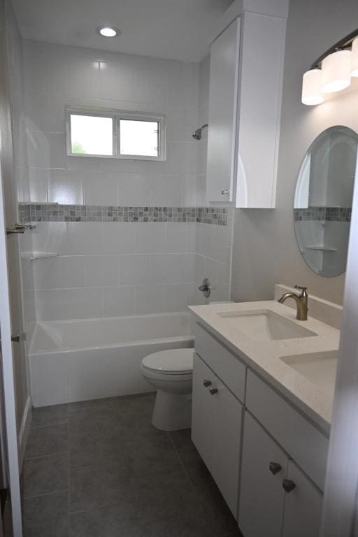 215 E 8th St, Elgin, TX 78621 - full bath featuring vanity,  shower combination, and tile patterned flooring