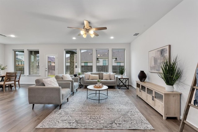 2437 Burberry Ln, Leander, TX 78641 - living room featuring a ceiling fan, light wood-style flooring, and recessed lighting