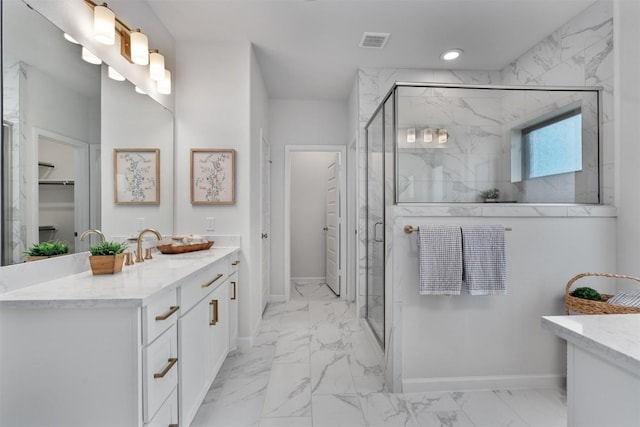 2437 Burberry Ln, Leander, TX 78641 - bathroom featuring marble finish floors, vanity, a marble finish shower, and recessed lighting
