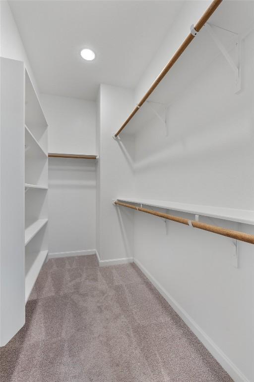 2437 Burberry Ln, Leander, TX 78641 - walk in closet with carpet flooring